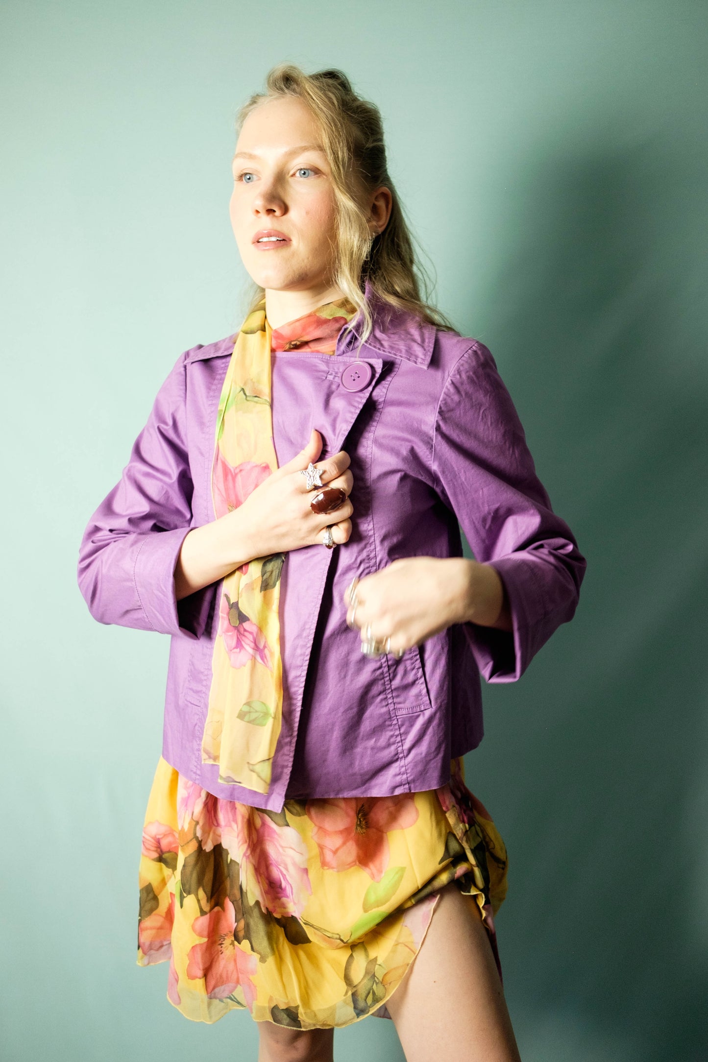 Close-up of large plastic buttons on lilac trench coat